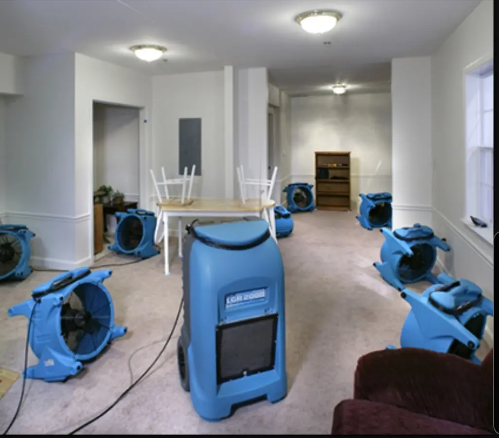 Air movers and dehumidifier setup for Water Damage Restoration in Waterville